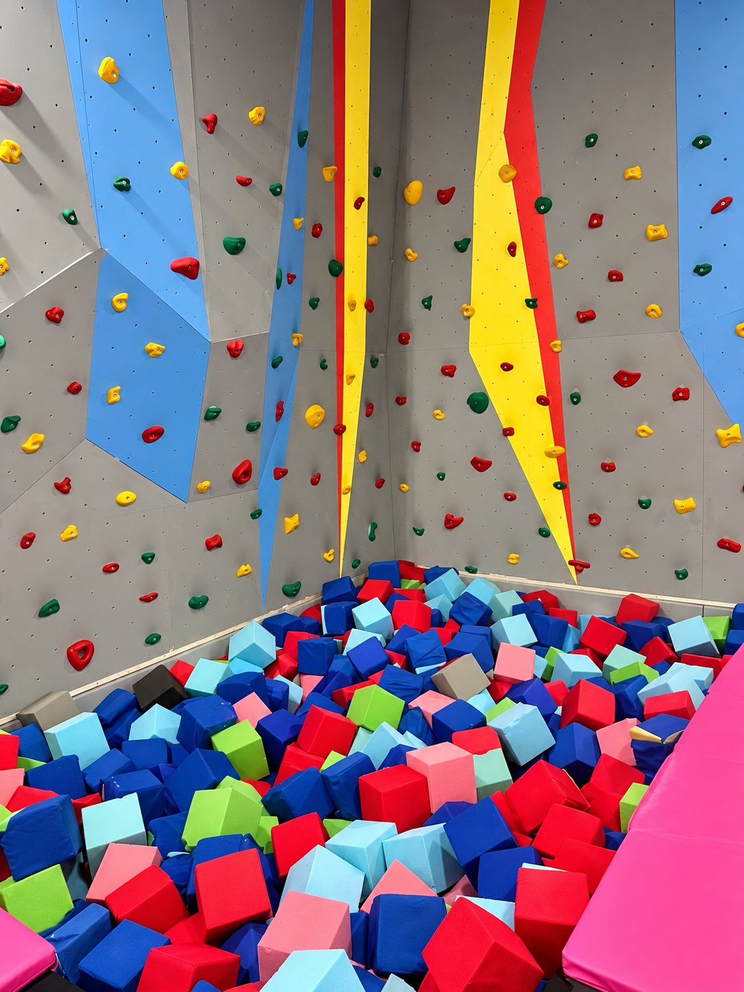 Climbing wall above the foam pit at FunZ Trampoline Park Waterbury